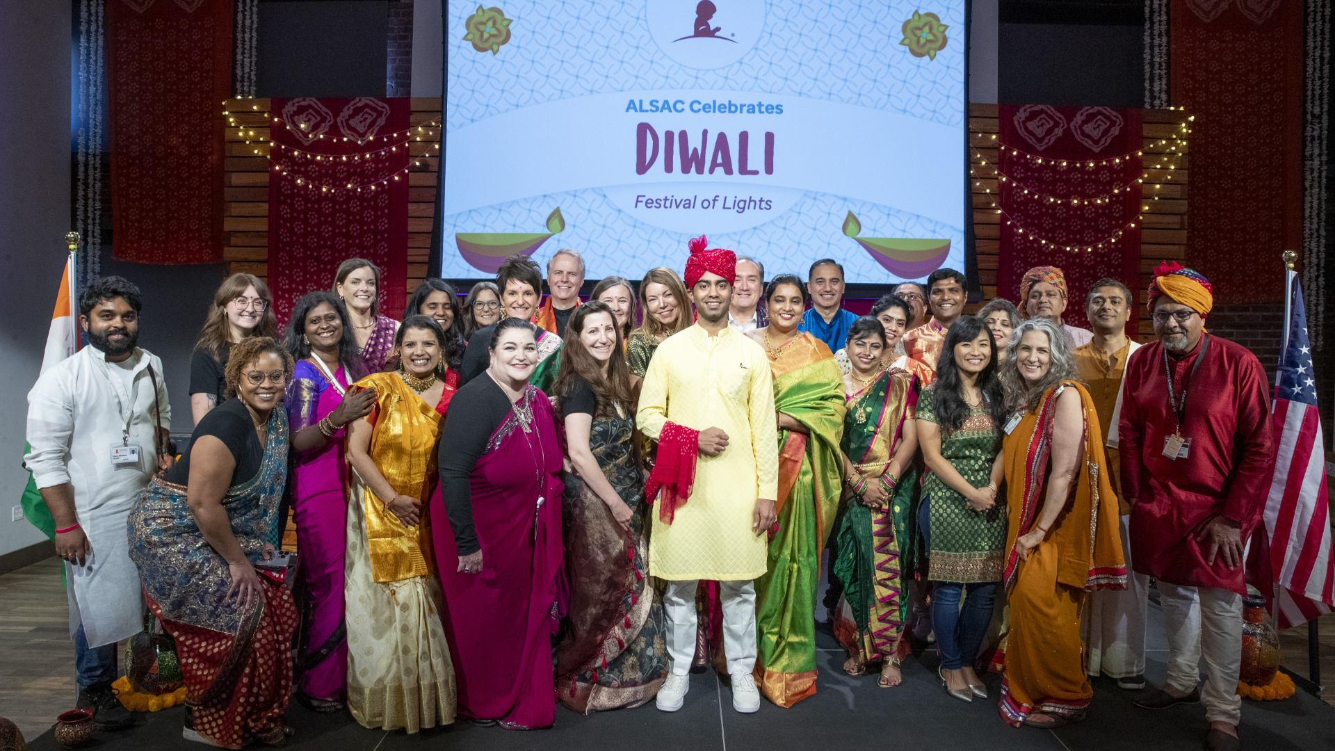 Yogesh Singh with a group of people posing for photo, wearing traditional Indian clothes.